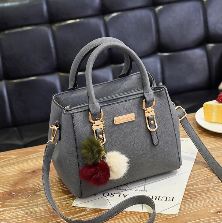 Wendy – Compact Structured Handbag with Fur Pom-Pom Charm