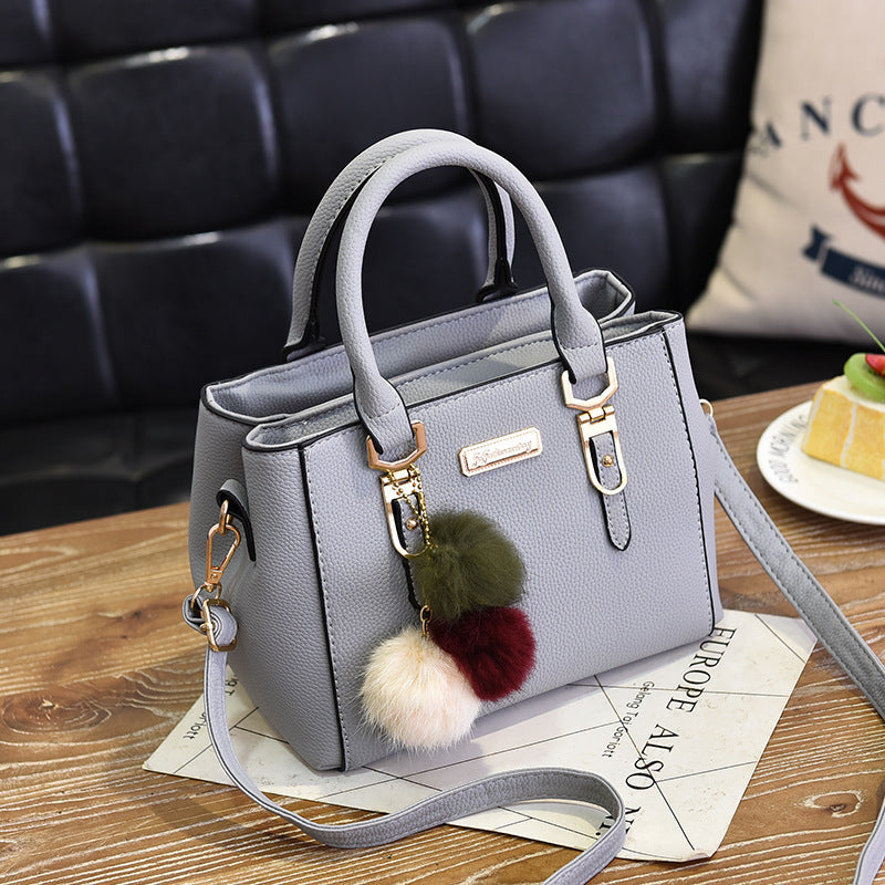 Wendy – Compact Structured Handbag with Fur Pom-Pom Charm