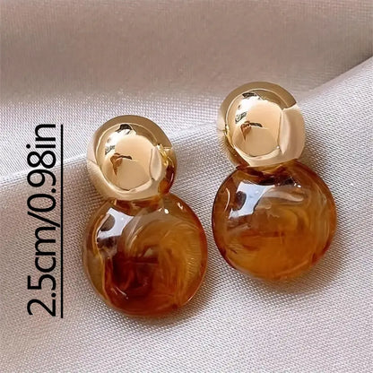 Golden Swirl Drop Earrings in Amber Tone