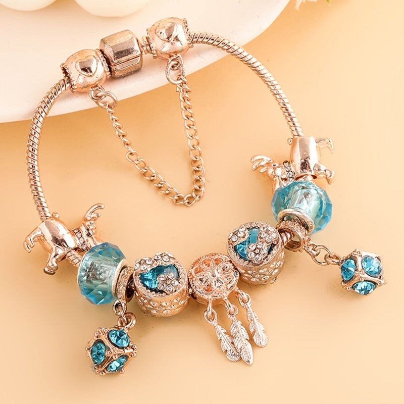 Rose Silver Charm Bracelet with Blue Crystal Accents