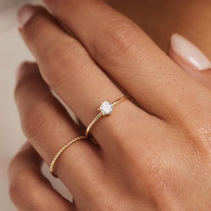 Solitaire Accent Ring in Gold with Sparkling Stone