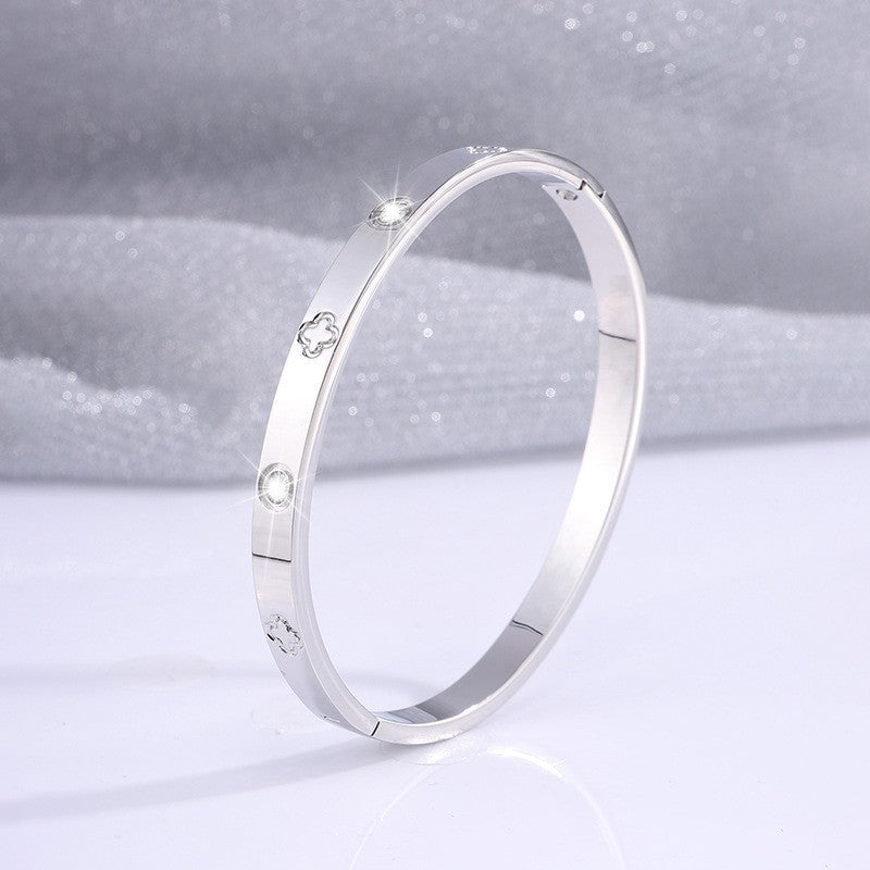 Crystal Accents Bangle Bracelet with Floral Motifs in Silver