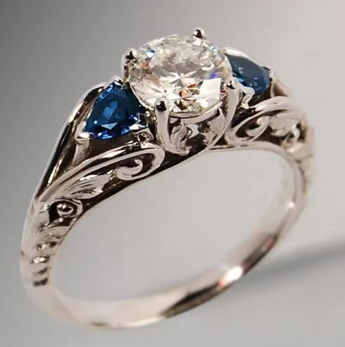 Vintage Filigree Ring with Sapphire Accents and Brilliant Centerpiece