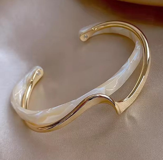 Wavy Gold and Pearl-Style Bangle Bracelet