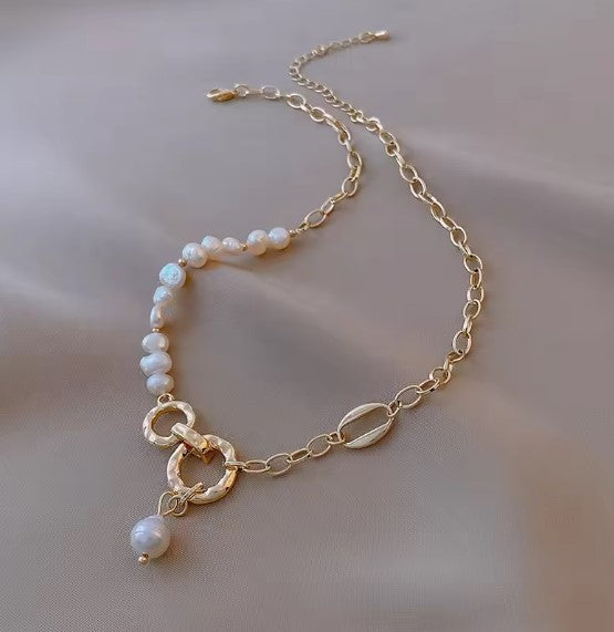 Asymmetrical Pearl and Gold Chain Necklace with Interlocking Rings