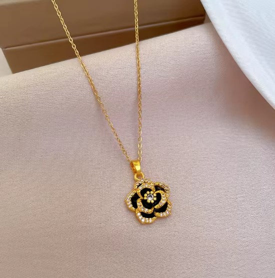 Black Enamel Flower Pendant Necklace in Gold with Sparkling Accents