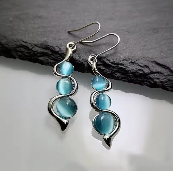 Blue Cat Eye Drop Earrings with Silver Swirl Design
