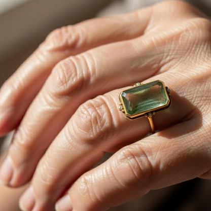 Rectangular Green Gemstone Ring with Gold Frame and Diamond Accents