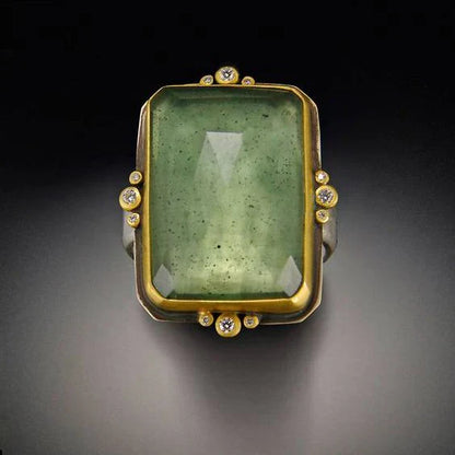 Rectangular Green Gemstone Ring with Gold Frame and Diamond Accents