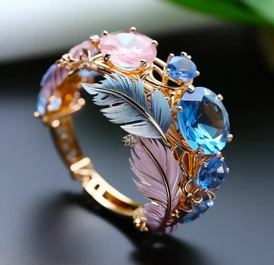 Feather Motif Ring with Blue and Pink Gem Accents